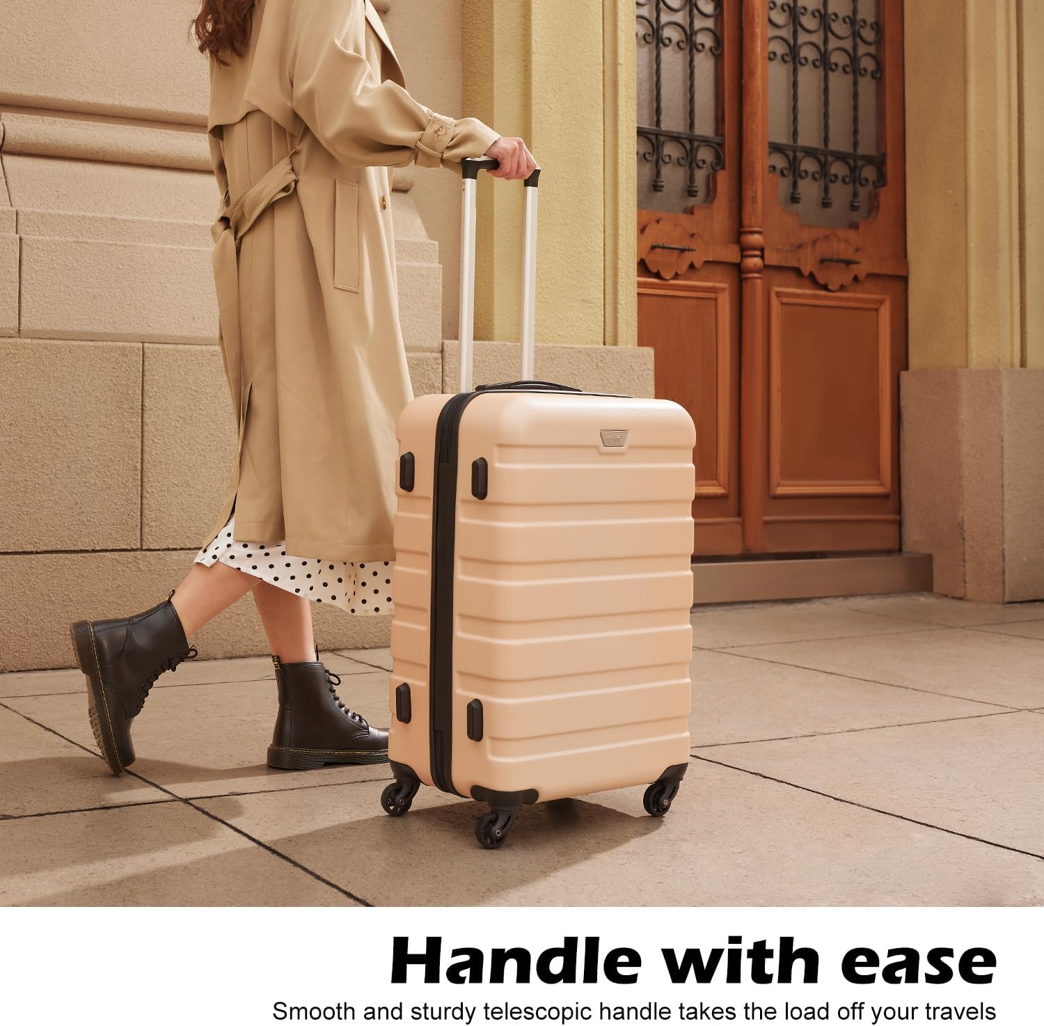 Traveler rolling a Coolife hardshell suitcase by its telescoping handle